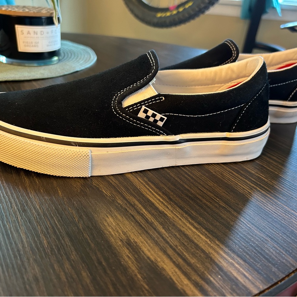 Vans Black and White Slip-On Sneakers